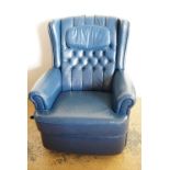 A blue leather recliner chair
