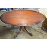 A contemporary mahogany oval topped coffee table, 120 x 75 x 59 cm