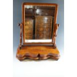 A Victorian mahogany swivel toilet mirror