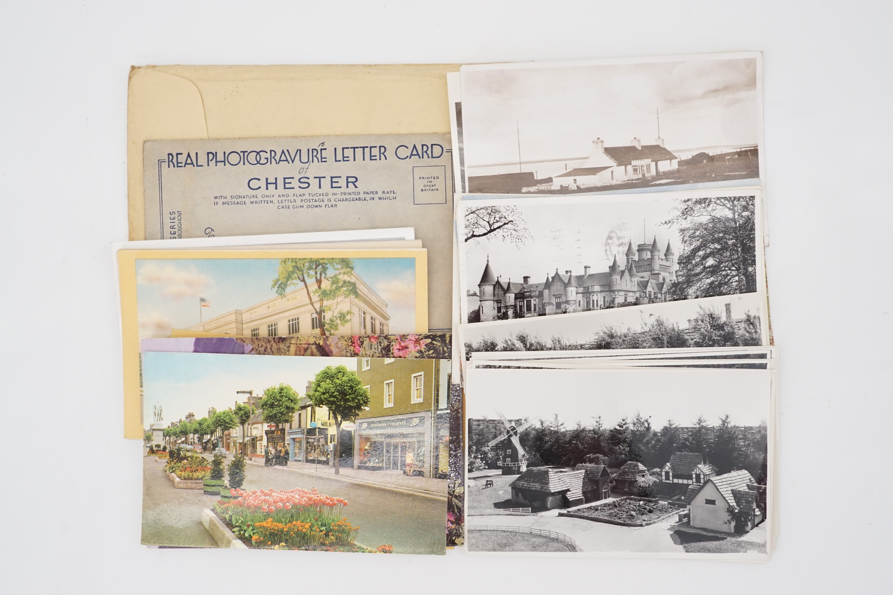 A small quantity of postcards, an "auto pen" signed photograph of Paul Henreid
