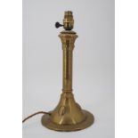 An early 20th Century Arts and Crafts influenced brass table lamp, 36 cm