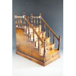 A Georgian style mahogany miniature chest of drawers modelled as steps leading to a podium, 43 cm