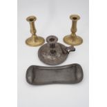 A pair of late Georgian brass candlesticks, a Victorian electroplate chamberstick and a Victorian