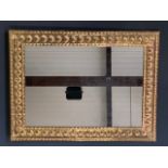 A 1920s / 1930s gilt framed wall mirror, with raised scallop shell decoration, 52 x 39 cm