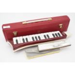 A Hohner Melodica Piano 27 and Echo harmonica