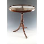 A reproduction Georgian mahogany wine or lamp table with oval top