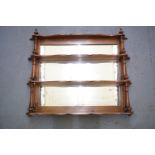 A Victorian set of mirror-backed "waterfall" hanging shelves, 60 cm