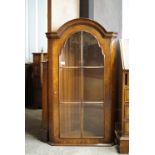 A reproduction burr-walnut veneered corner cabinet, 120 cm