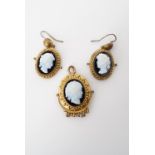 A Victorian cameo ear and neck pendant set, each having pressed cameos depicting the profile of a