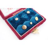 A late Victorian cased set of three 9ct gold shirt studs, and two matching rolled-gold examples,