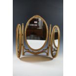 A fancy gilt-framed triptych dressing table mirror