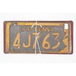 Vintage US tinplate car registration plates