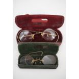 A cased pair of pince nez and cased pair of spectacles