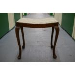 A George V mahogany dressing table stool.