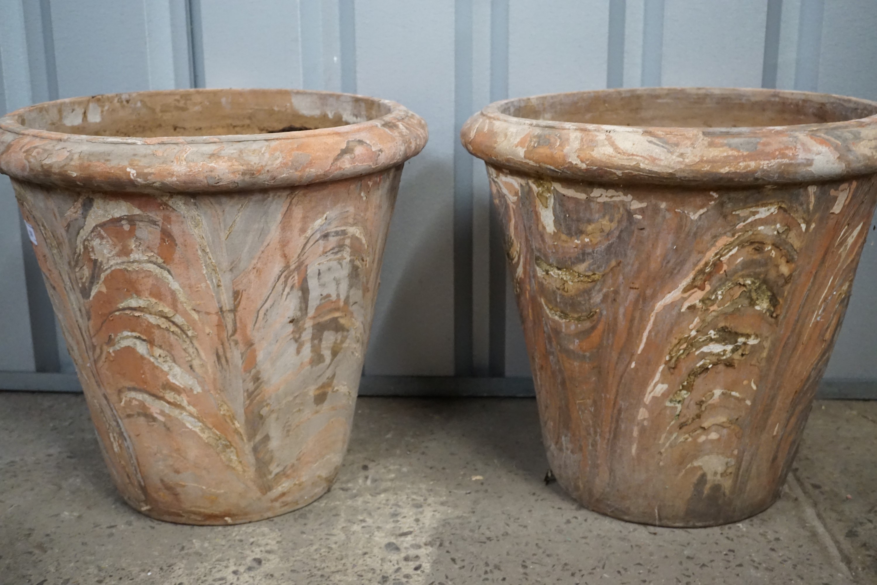 A pair of large terracotta garden planters, 47 cm high