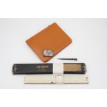 A vintage Equestrian brand pigskin travelling stationary case including key, notepad and perpetual
