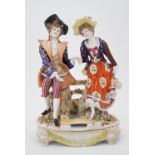 A continental porcelain figure group modelled as a young courting couple in 18th Century dress