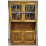 A leaded-glazed oak bookcase cabinet, 92 cm x 152 cm high