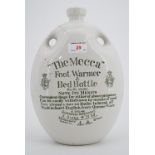 A transfer-printed "Mecca foot warmer and a bed [hot water] bottle"