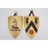 Two late 19th / early 20th Century painted tinplate wall-hanging armorial shields, 29 cm