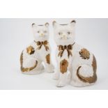 A pair of Staffordshire style ceramic cats, 20 cm