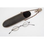 A late 19th / early 20th Century chatelaine spectacles case containing a pair of wire-rimmed