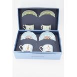 Two cased pairs of cups and saucers from the Wedgwood Millennium collection