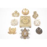 A shoulder belt plate, cap and other badges