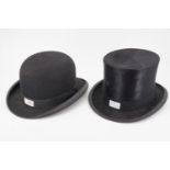 A vintage bowler hat by Andrew Houston of Carlisle together with a top hat