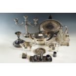 A quantity of electroplate including a three-piece tea set, candelabrum, cruet sets etc