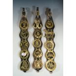 Three horse brass straps