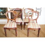 Four Victorian mahogany bolt-back dining chairs
