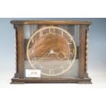 A 1920s oak mantle clock, 16 cm high