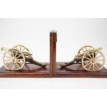 A pair of Battle of Waterloo commemorative book ends, each supporting a die-cast scale model Royal