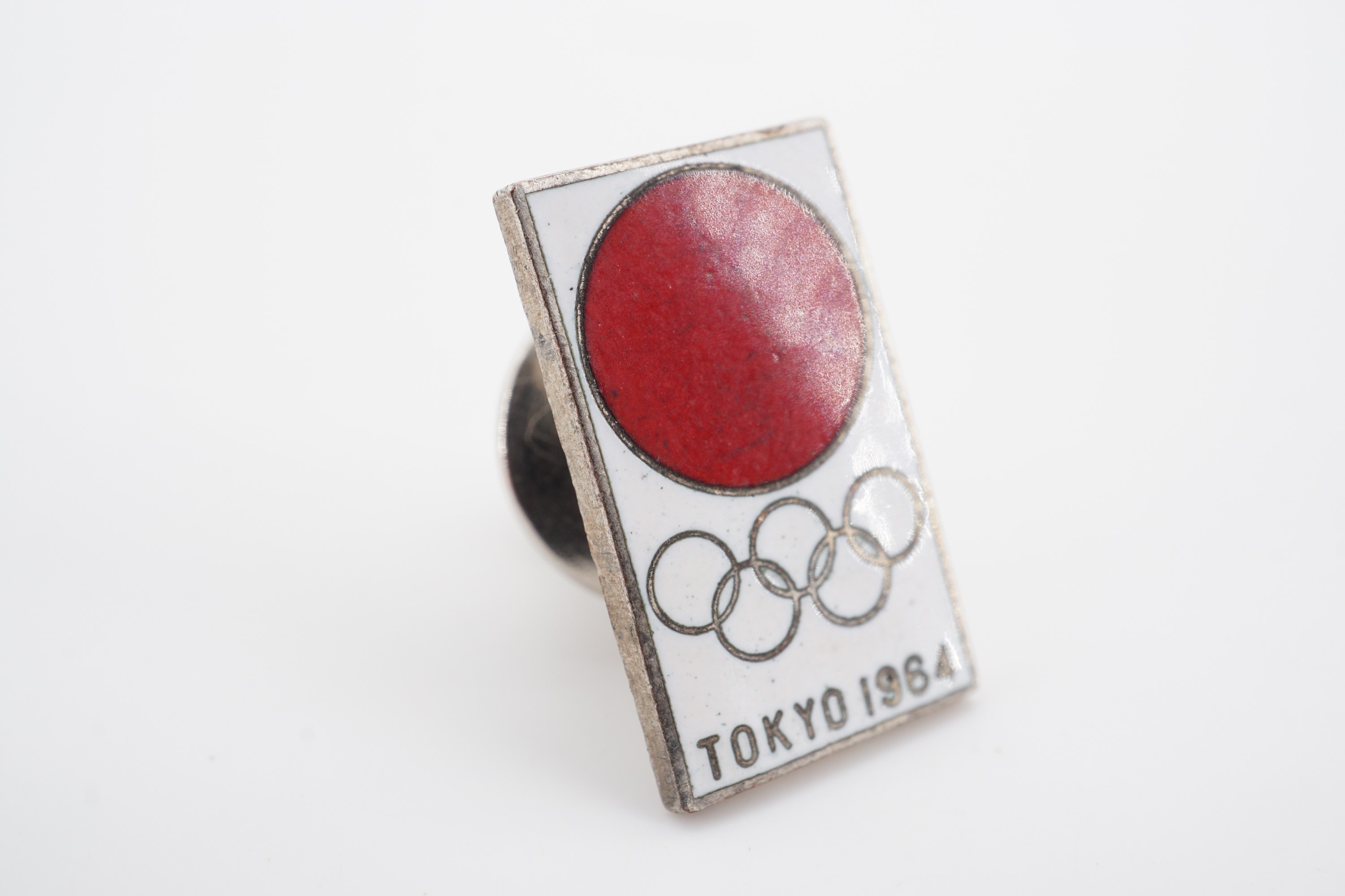 A 1964 Tokyo Olympics enamelled lapel badge