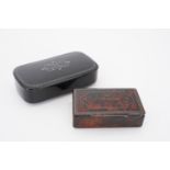 A 19th Century Japanned snuff box, and one other faux tortoiseshell example of scumbled papier