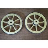 A pair of antique wooden small cart wheels with iron tyres, 50 cm