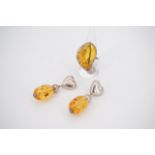 Contemporary white metal and amber jewellery, including a pair of ear pendants with heart-shaped