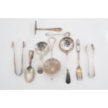 Vintage electroplate flatware, including caddy spoon, tea strainer, dredger, two pairs of sugar