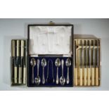 A late Victorian / Edwardian cased set of electroplate tea spoons and sugar tongs, and two boxed