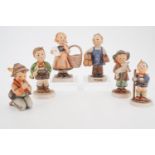 Six Hummel figurines including Boots and Meditation etc