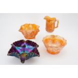 Three carnival glass bowls and a jug