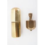 A trench art cigarette lighter and brass Put and Take gambling game spinner