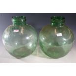 Two green glass carboys / terrariums, 32 cm