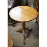 An early 19th Century mahogany tripod tea table, 54 cm x 72 cm
