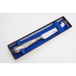 An Elizabeth II silver handled cake knife in original presentation box