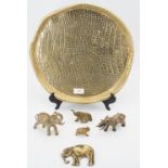 A brass tray and five brass elephants