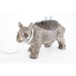 A Victorian EPBM novelty pin cushion in the form of a rhinoceros, with inset glass eyes, 8 cm x 5 cm