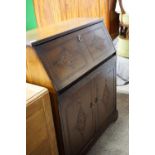 A contemporary carved oak effect bureau, 86 x 41 x 100 cm