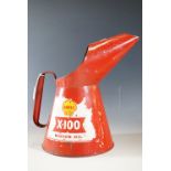 A Shell X-100 motor oil can